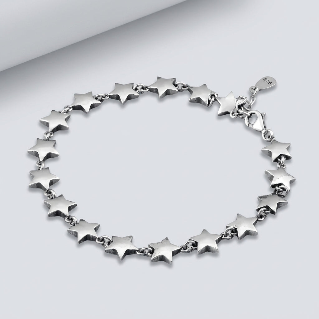 Silver star bracelet on a wooden surface