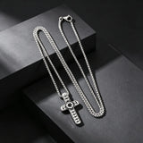 Collier élégant à pendentif croix texturé