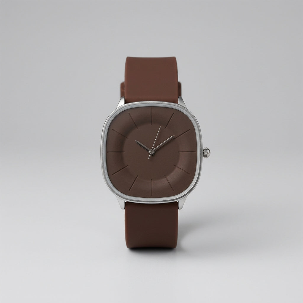 Watch with brown strap and dark brown dial on a textured surface