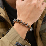 Pulsera de cuerda tejida con columna vertebral espinosa de metal