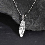 Collar pequeño de cocotero con tabla de surf