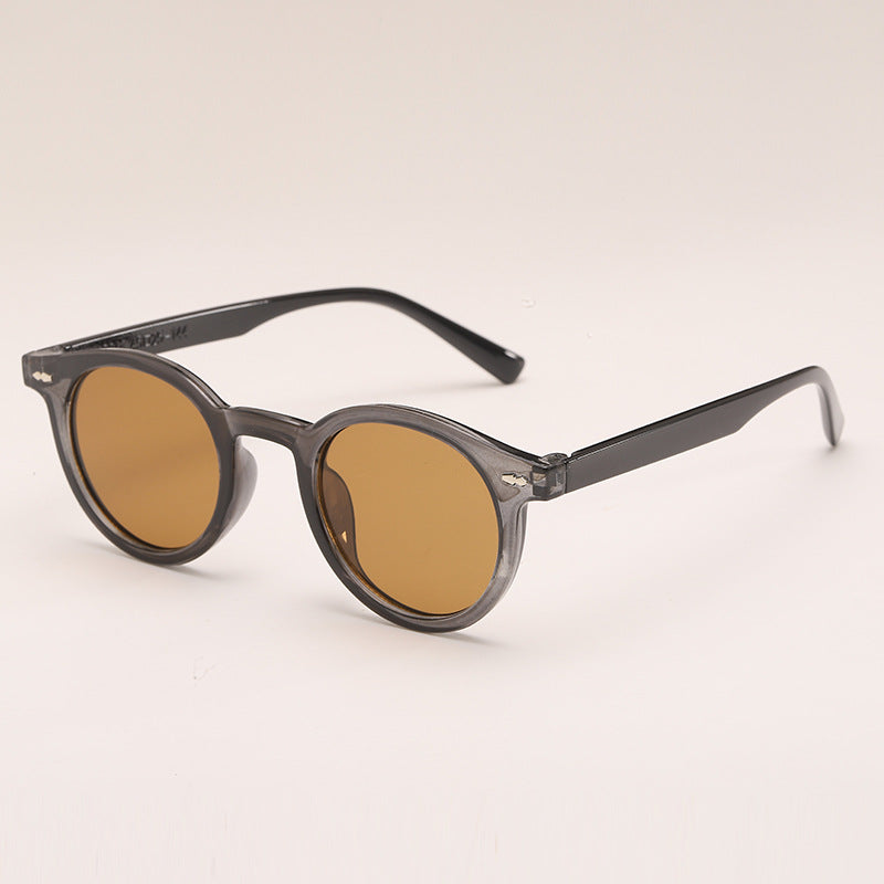 Lunettes de soleil de couleur unie ronde à la mode