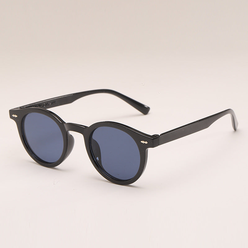 Lunettes de soleil de couleur unie ronde à la mode