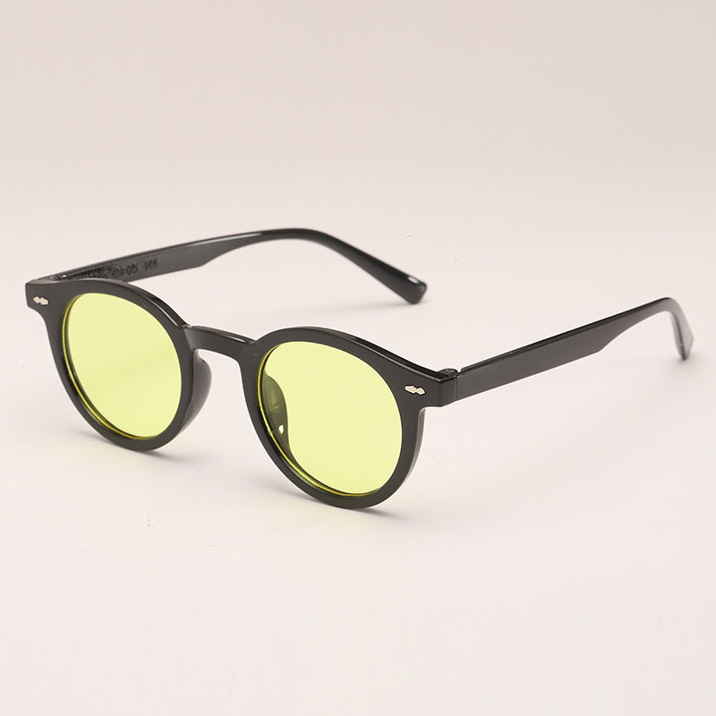Lunettes de soleil de couleur unie ronde à la mode
