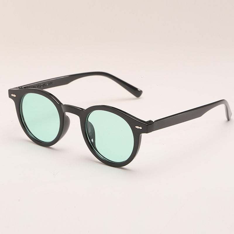 Lunettes de soleil de couleur unie ronde à la mode