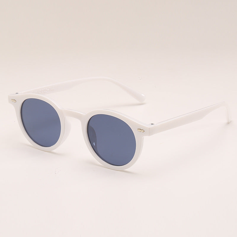 Lunettes de soleil de couleur unie ronde à la mode